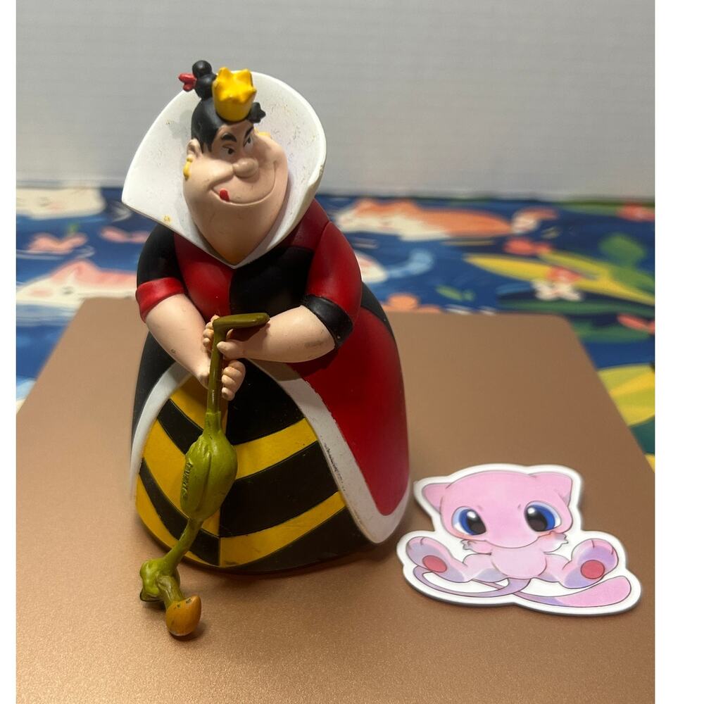 Alice in Wonderland Queen Figure Holding Bird Club